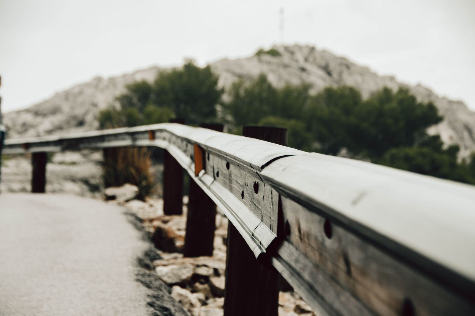 Close-up of a metal guardrail on a mountain road in Mallorca, Spain.