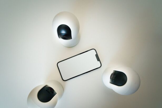 Smartphone surrounded by security cameras on a modern, minimalist setup.