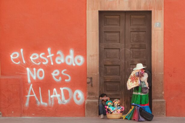 A colorful street vendor scene with political graffiti in Querétaro, Mexico.