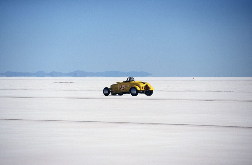 Vintage yellow hot rod racing on the Bonneville Salt Flats. High speed adventure.