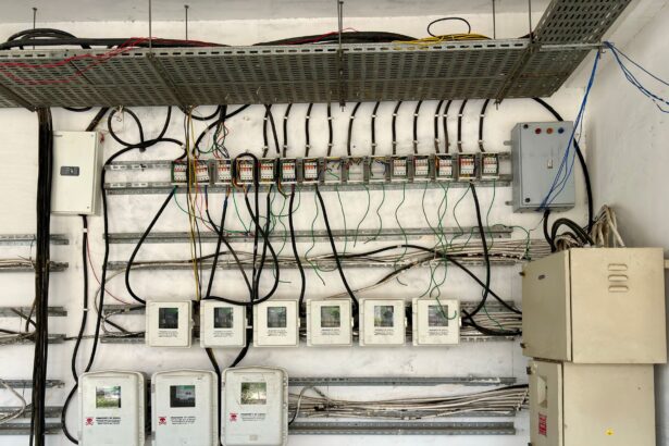 Complex network of electrical wiring and control panels in an industrial setting.