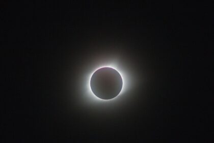 A breathtaking view of a full solar eclipse, showcasing the sun's corona.