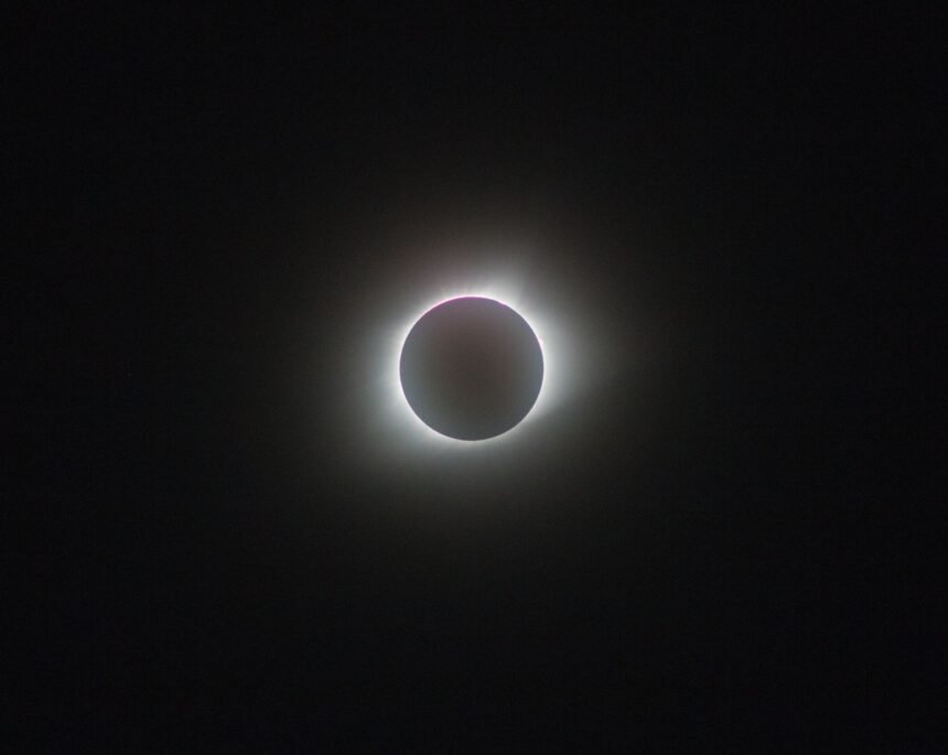 A breathtaking view of a full solar eclipse, showcasing the sun's corona.