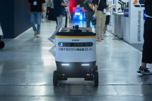 Autonomous delivery robot navigating indoors during a technology event.