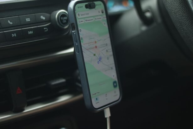 A smartphone with a map app displayed inside a car, showing modern navigation.