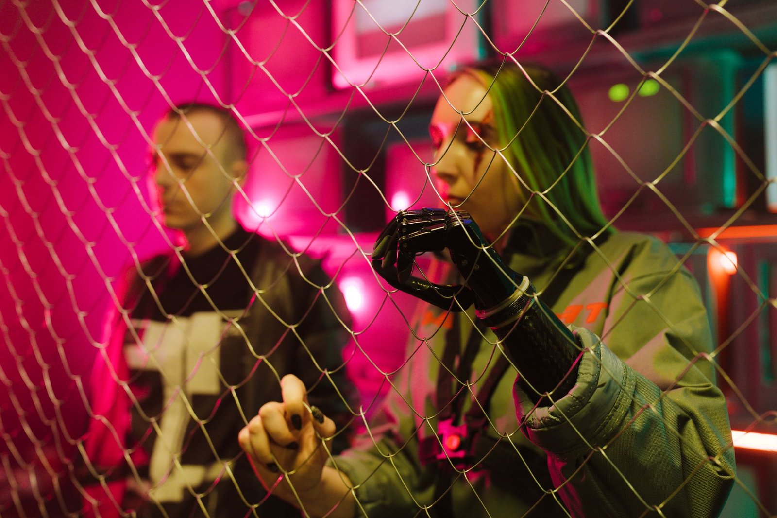 A cyberpunk-themed photo with two people and neon lights creates a futuristic ambiance.