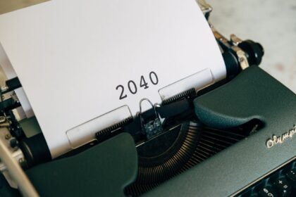 Close-up of a vintage typewriter with a paper showing the year 2040, capturing a nostalgic yet futuristic feel.