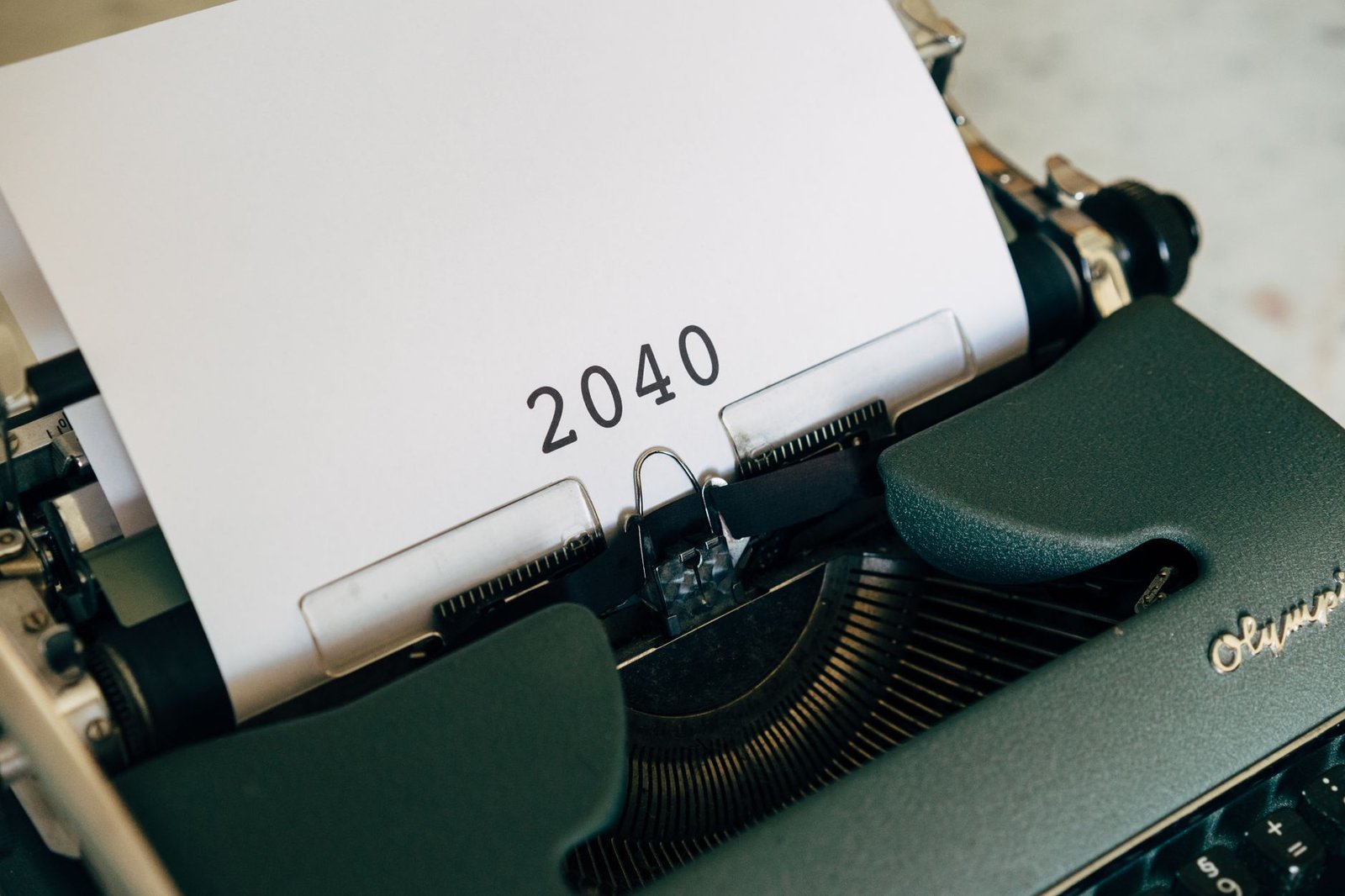 Close-up of a vintage typewriter with a paper showing the year 2040, capturing a nostalgic yet futuristic feel.