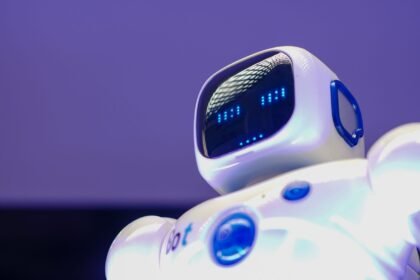 A modern humanoid robot with digital face and luminescent screen, symbolizing innovation in technology.