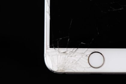 Detailed image of a cracked smartphone screen highlighting damage to the device.