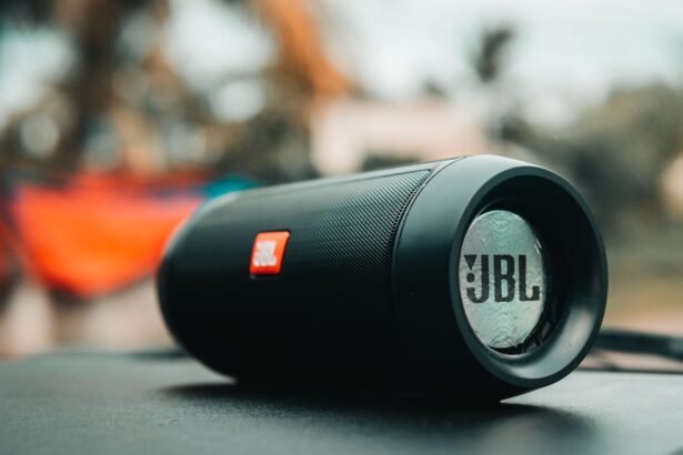 Focused shot of a black JBL portable speaker on a surface, ideal for technology concepts.