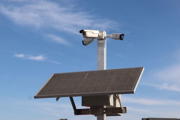 Surveillance camera powered by solar panel against a clear blue sky in Sacramento.