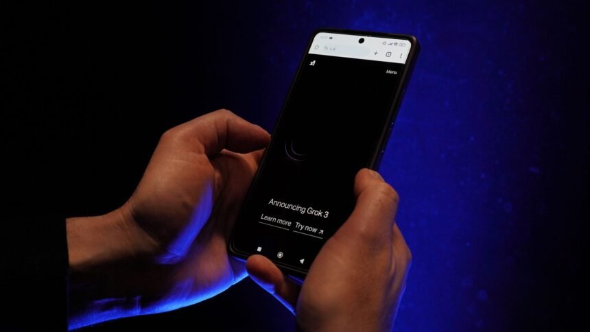 Close-up of hands holding a smartphone displaying 'Announcing Grok 3' on a dark background.