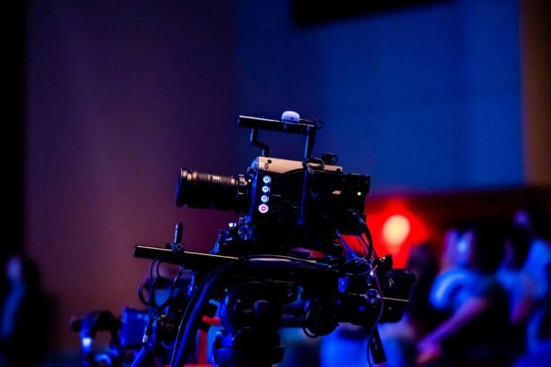 A high-quality camera setup capturing a live studio event with an audience in the background.