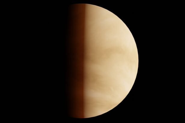 A striking image of Venus partially illuminated against a dark background, highlighting its atmospheric details.