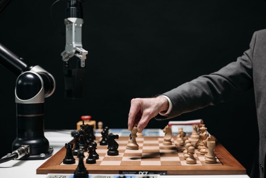 A robotic arm plays chess against a human, symbolizing AI innovation and strategy.