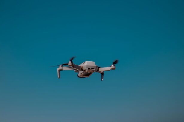 Aerial drone flying in the open sky on a clear day, showcasing modern technology.