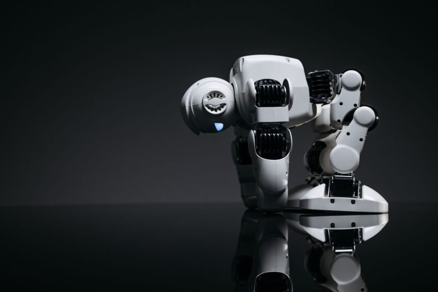 A modern robot toy depicted in a studio environment with its reflection visible on a dark surface.