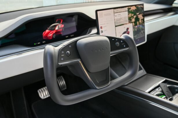 Explore the cutting-edge design of the Tesla car interior featuring a futuristic steering wheel and advanced touchscreen displays.
