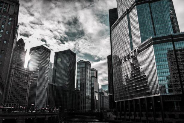 Chicago cityscape featuring Trump Tower with dramatic reflections against a cloudy sky.