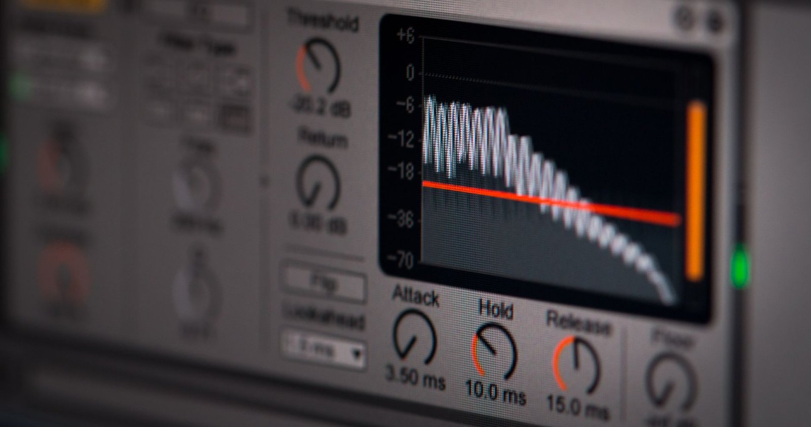 Close-up of audio editing software interface featuring waveform and controls.